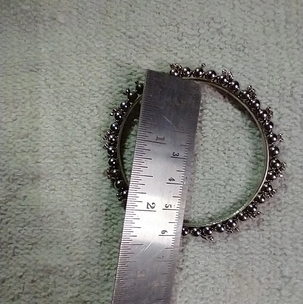 Silvertone decorative bangle bracelet